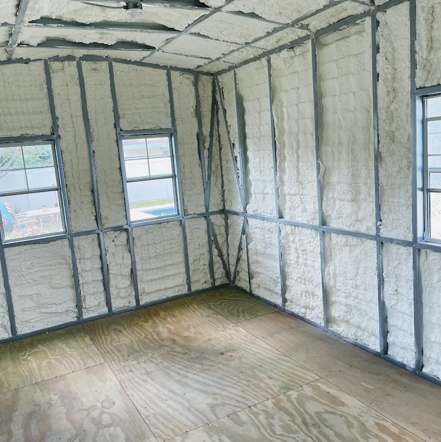 Closed-cell spray foam insulation applied to wall cavities in a residential project in Des Moines